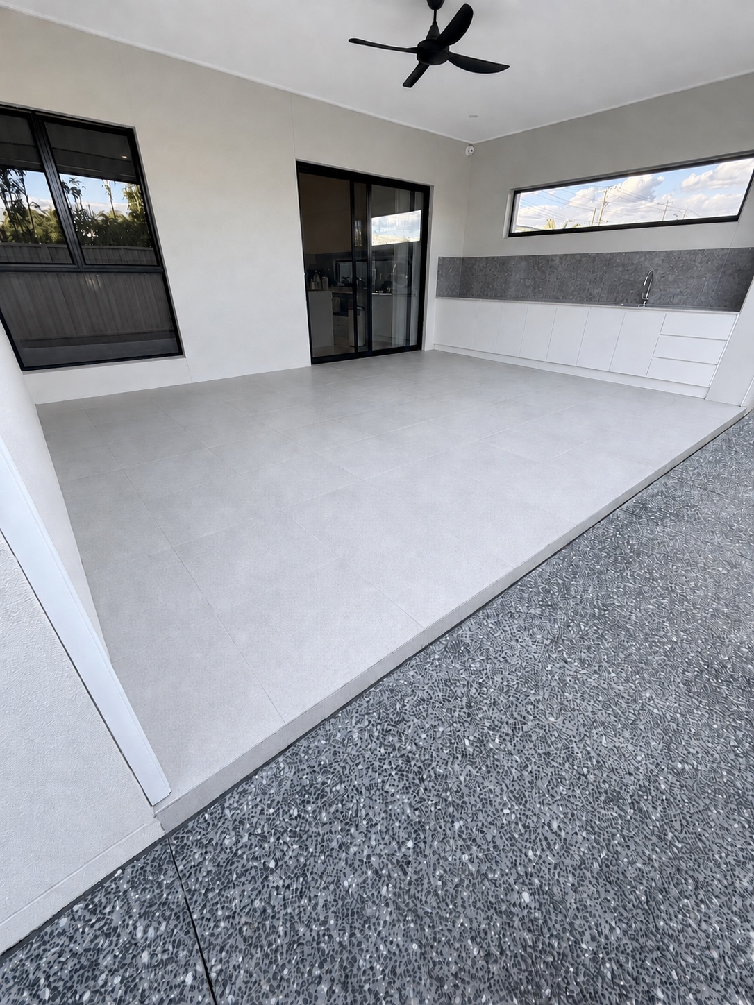 Covered outdoor tiled area treated with a Stellmann P4 non-slip coating